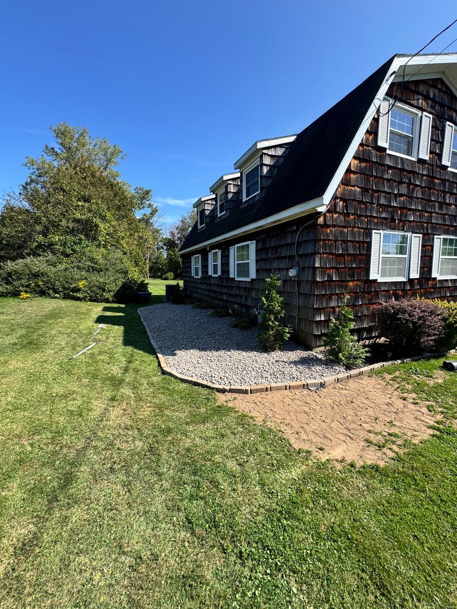 Finished landscape bed beside a home